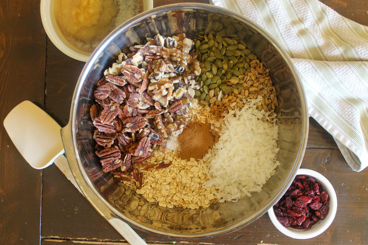 Dry ingredients for granola in a large mixing bowl.