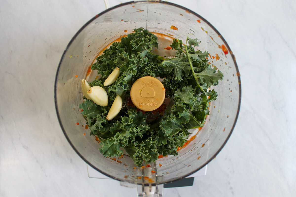 Kale and garlic in food processor.