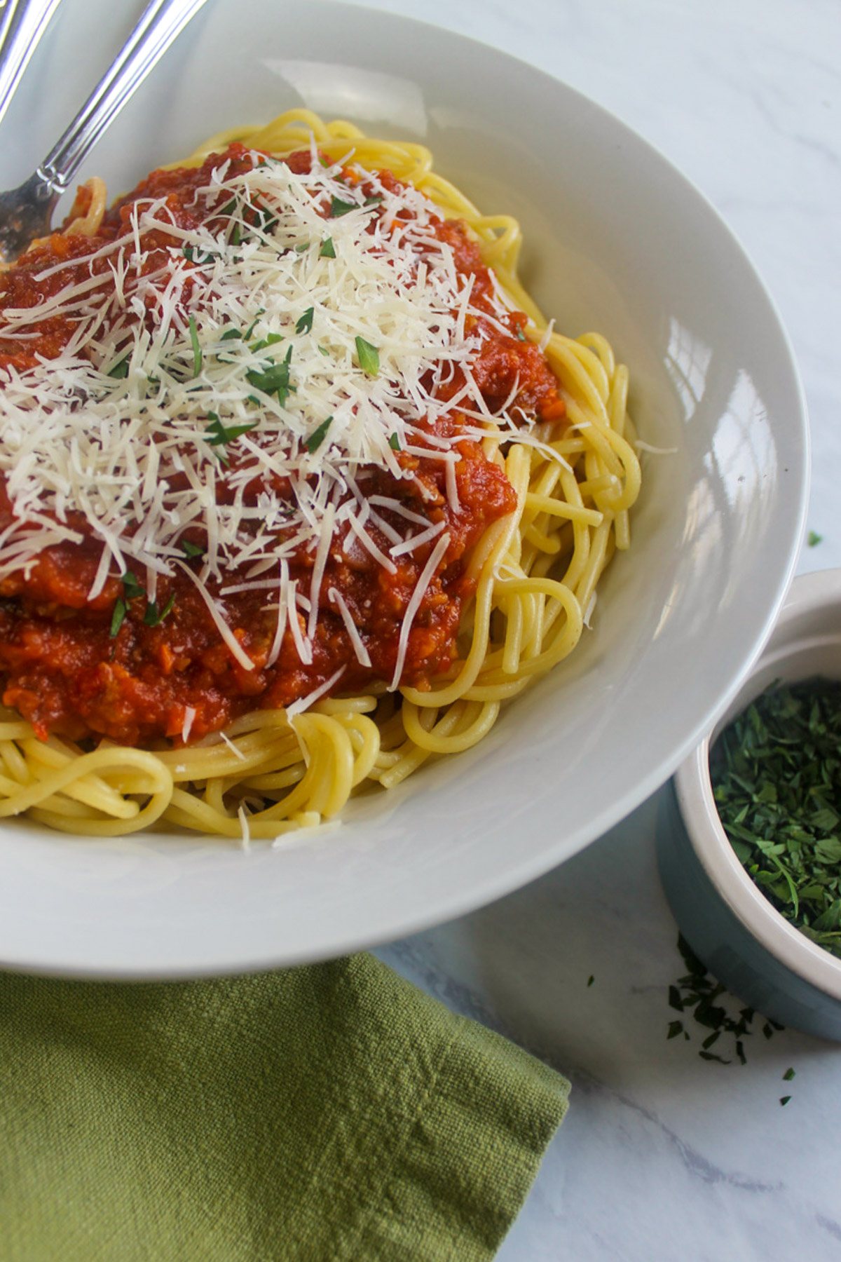 A white bowl of healthy vegetable Bolognese Sauce with Spaghetti.