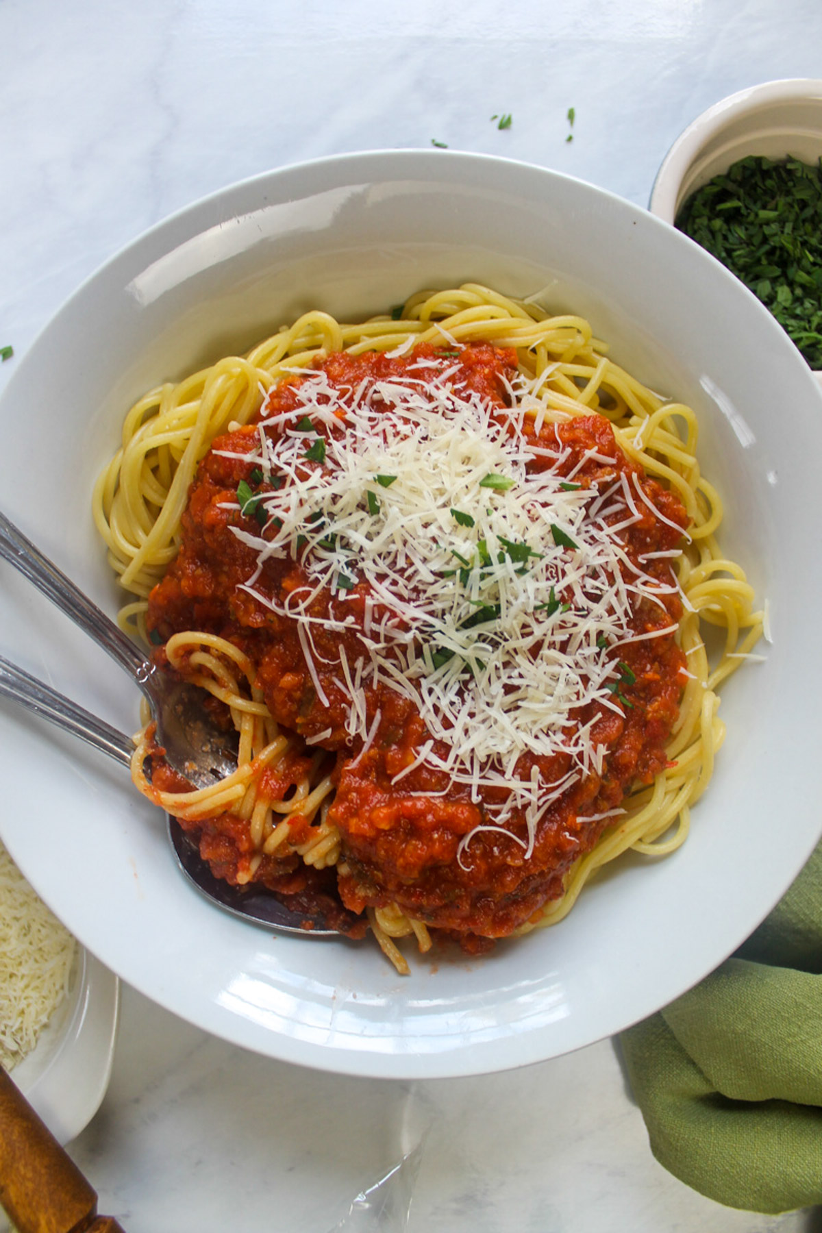 A bowl of Italian Sausage Bolognese with spaghetti.