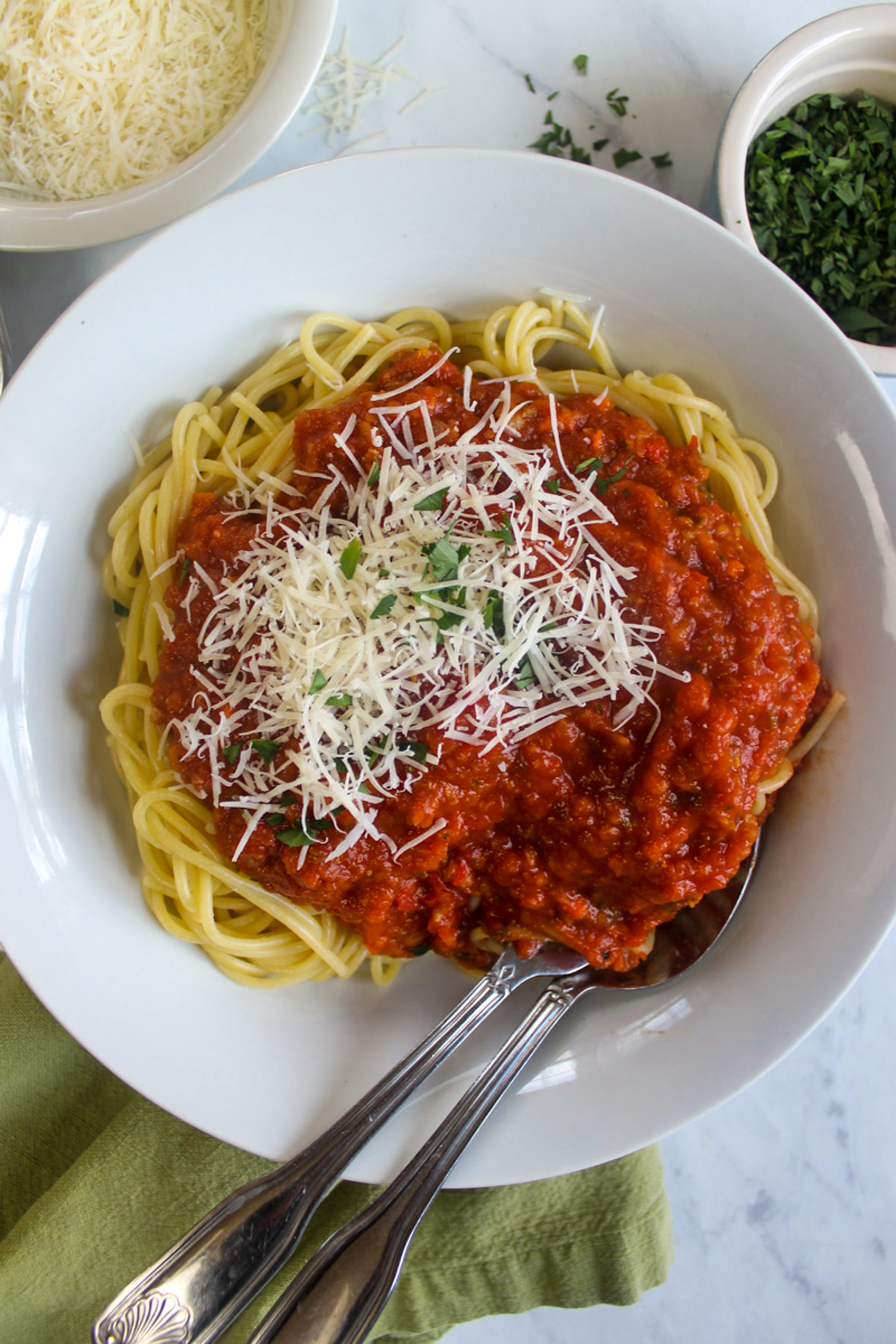 Italian Sausage Bolognese Sauce with Spaghetti pasta and Parmesan cheese.
