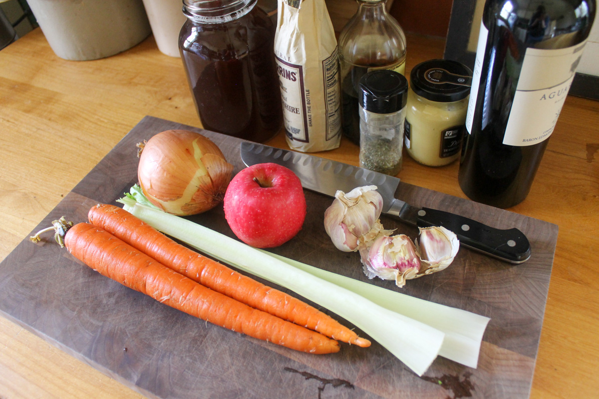 Beef roast ingredients on a cutting board.