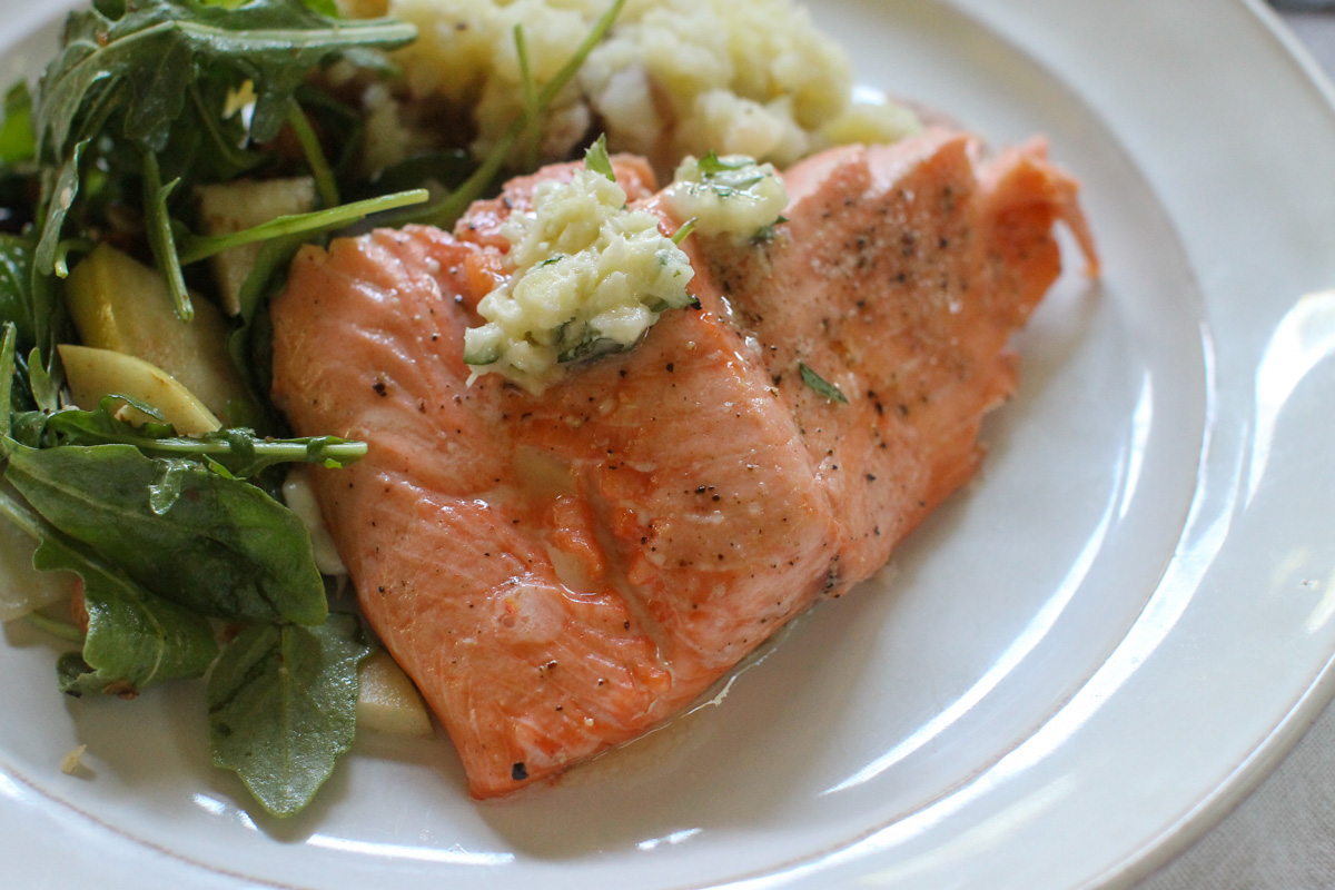 Oven roasted wild salmon with garlic honey butter.
