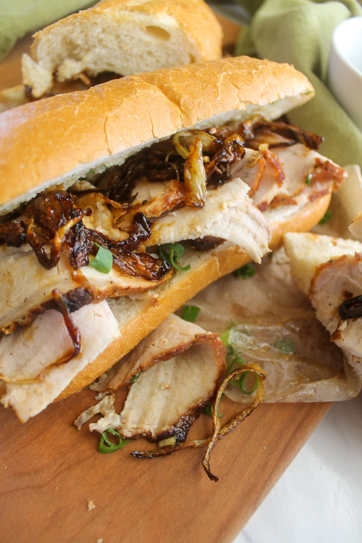 Shaved pork roast sandwiches with crispy caramelized onions.