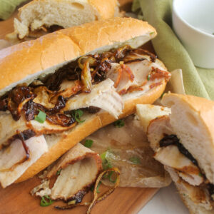 Thinly shaved pork roast sandwiches on long hoagie buns with caramelized onions.