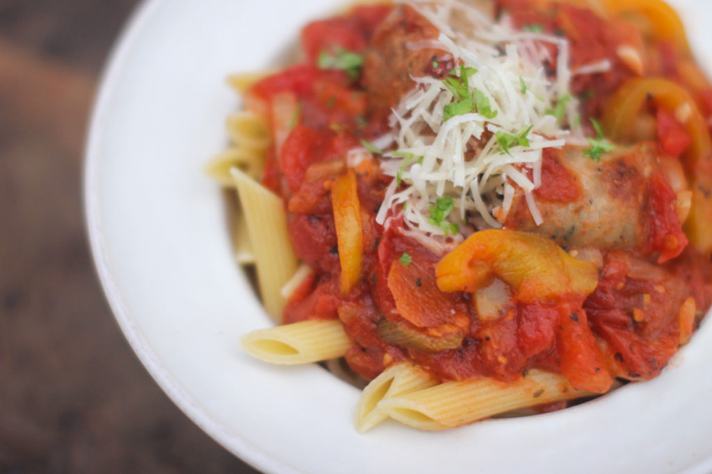 Suasage peppers and onions pasta sauce over penne.