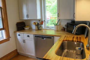 Newly remodeled kitchen with butcher block counters.