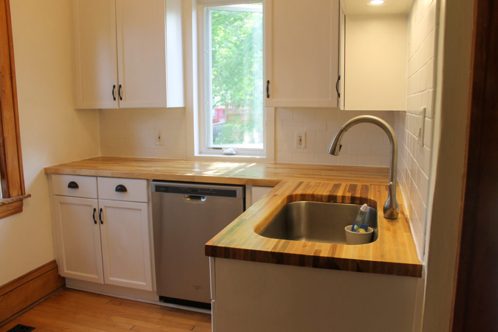 Small kitchen upgrade with undermount sink and white subway tile.