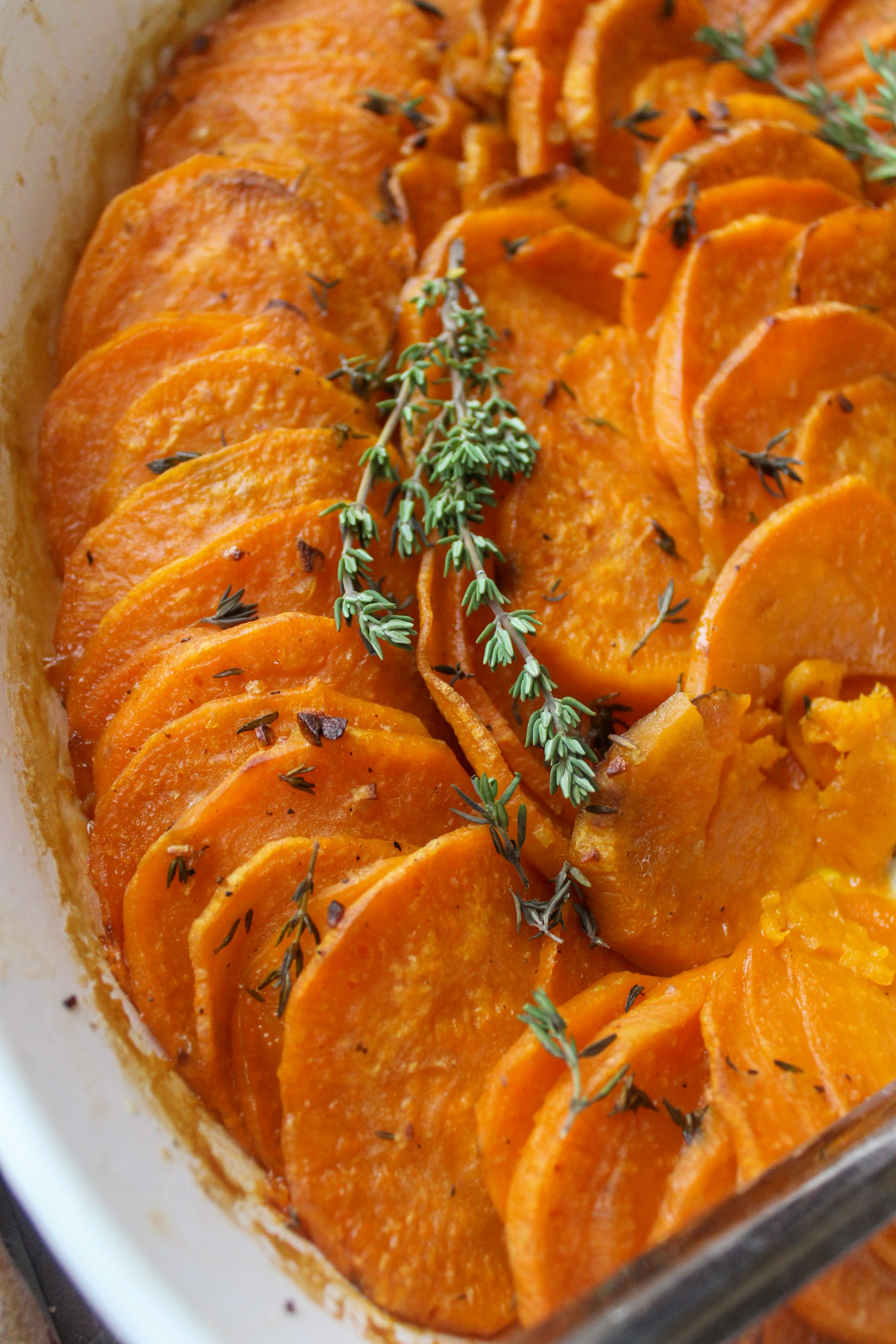 Baked sweet potato rounds cooked in garlic honey butter.