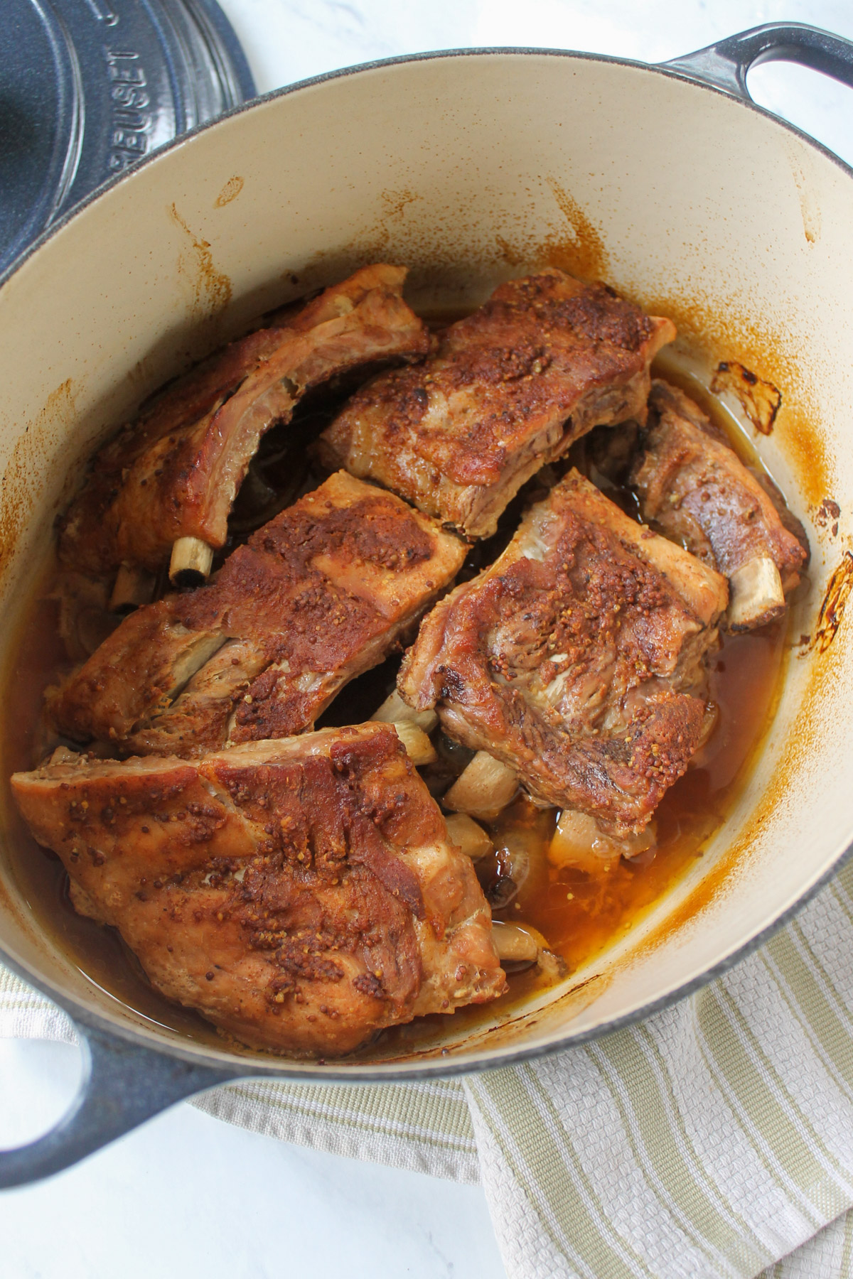 The baked ribs in a Dutch oven.