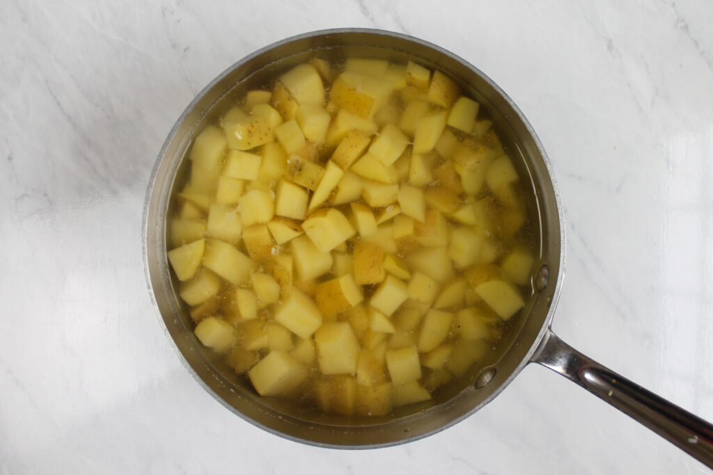 Potatoes ready to boil in a separate pot to be added to the chowder later.