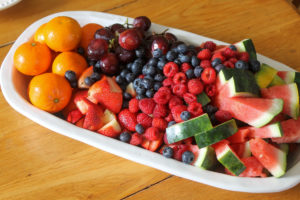 Kid Friendly Fresh Fruit Tray with grapes, watermelon, berries and cutie oranges.