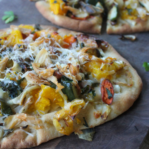 Roasted Vegetable Flatbread Pizza with Parmesan cheese and herbs.