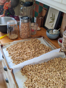 Almond Spiced Granola on sheet pans for the oven