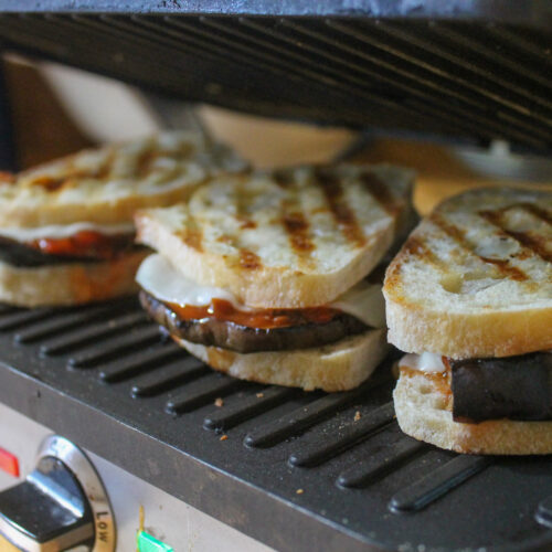 Eggplant paninis with grilled eggplant, cheese and tomato sauce.