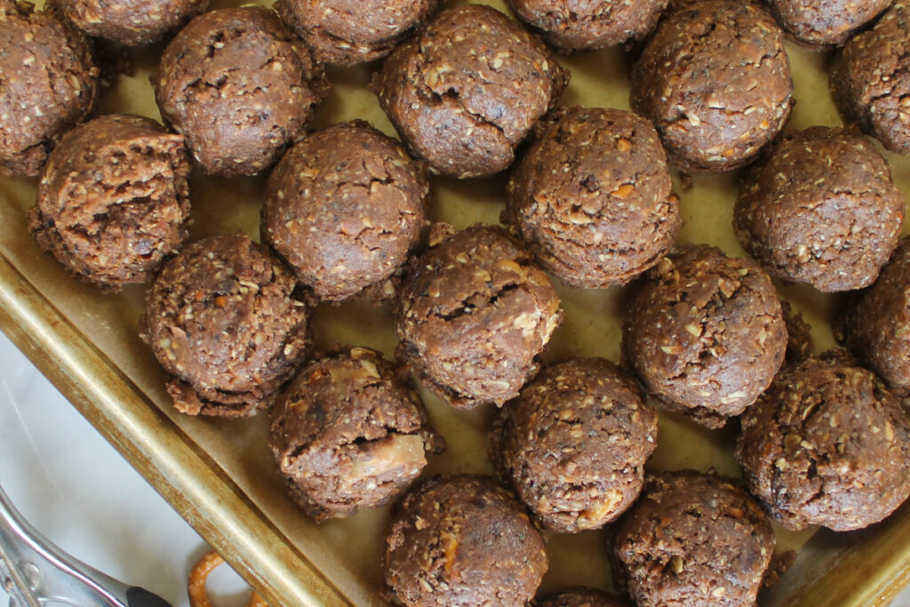 Close up of Nutella Energy Bites on a sheet pan with parchment paper.