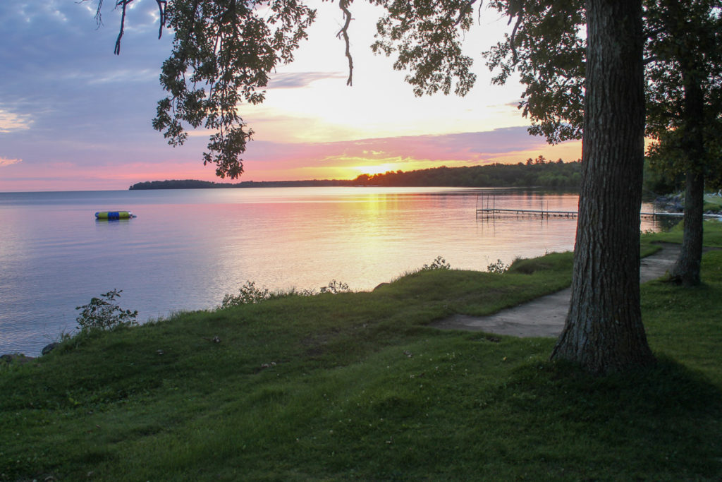 A beautiful picture of nature, a sunset over a lake.