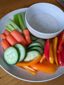 A kid friendly dinner side with raw veggies and dip.