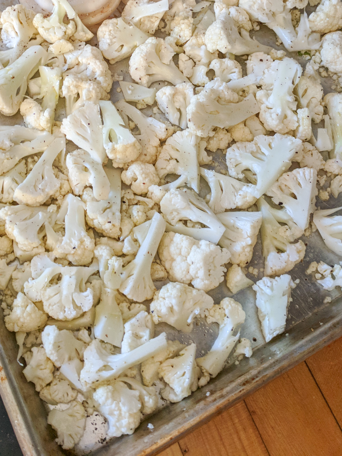 Chopped cauliflower ready to roast for a kid friendly side dish.