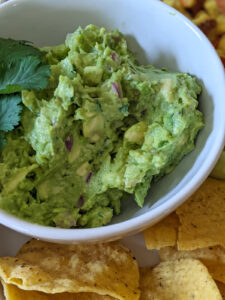 Mashed avocado, a simple guacamole dinner side dish for kids.