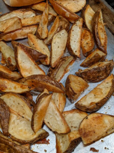 Oven fries, a pan of roasted potato wedges.