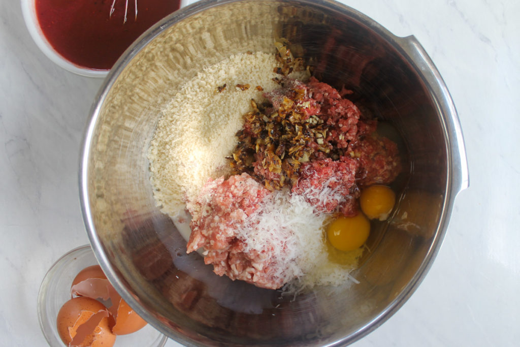 A large bowl of homemade meatball ingredients.