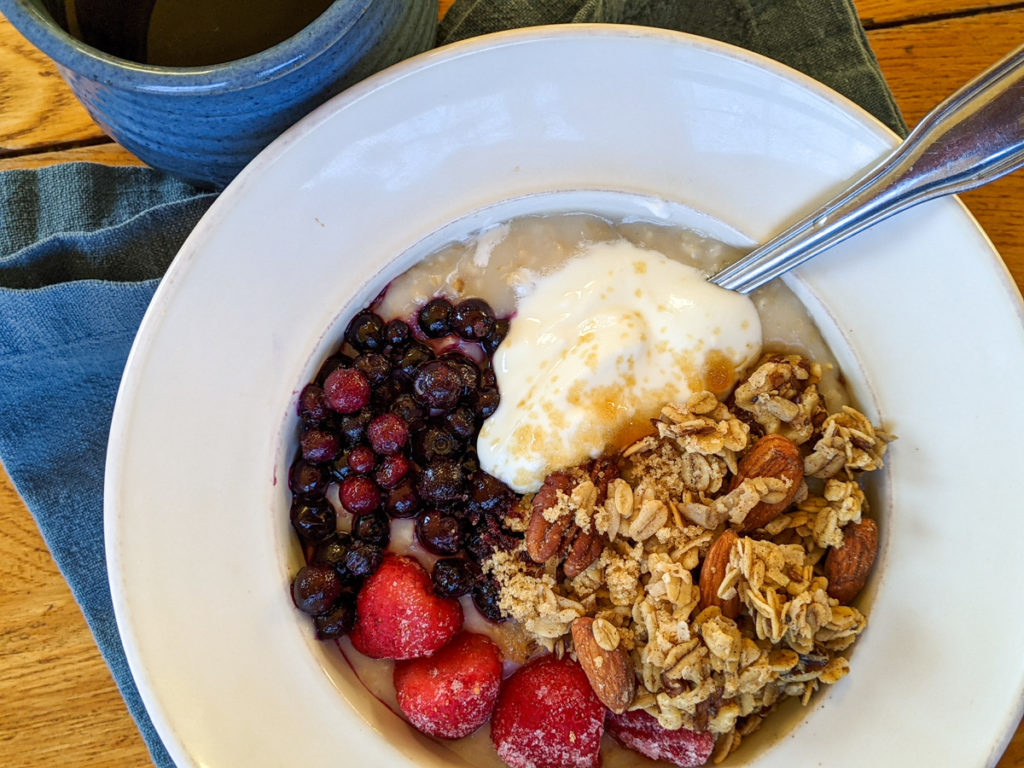 Crockpot Steel Cut Oatmeal with berries yogurt and granola