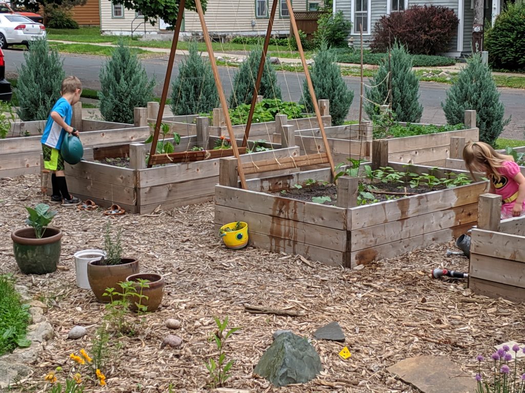 Raised Bed Vegetable Gardens, kids helping Kids watering the garden.
