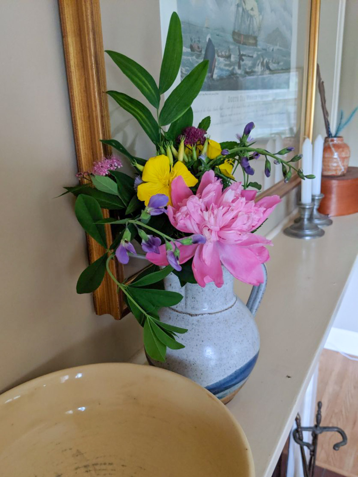 A bouquet of fresh cut flowers from the garden in a vase.
