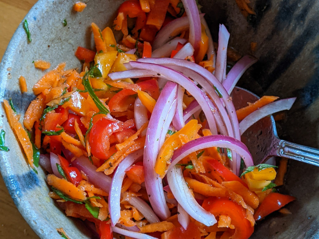 Bowl of homemade fresh giardiniera veggies in vinegar mix.