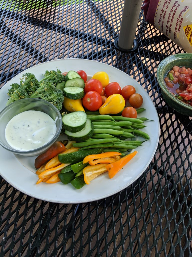 Veggies and Dip with Garden Harvested Broccoli, Tomatoes, Cucumber, Green Beans and Bell Peppers Garden fresh snack, veggies and dip.