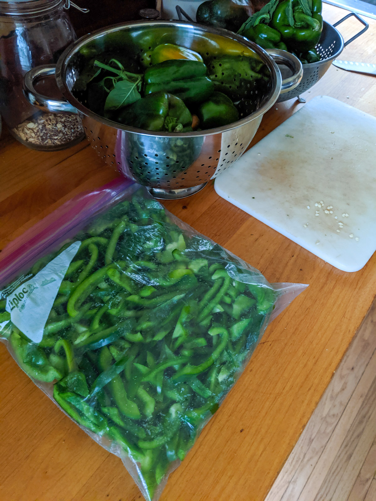 A ziploc bag of sliced green bell peppers for the freezer.