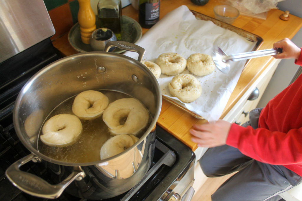 Child cooking homemade bagels