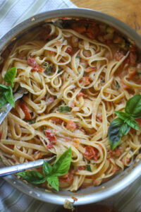 Finish dish of creamy tomato basil pasta.