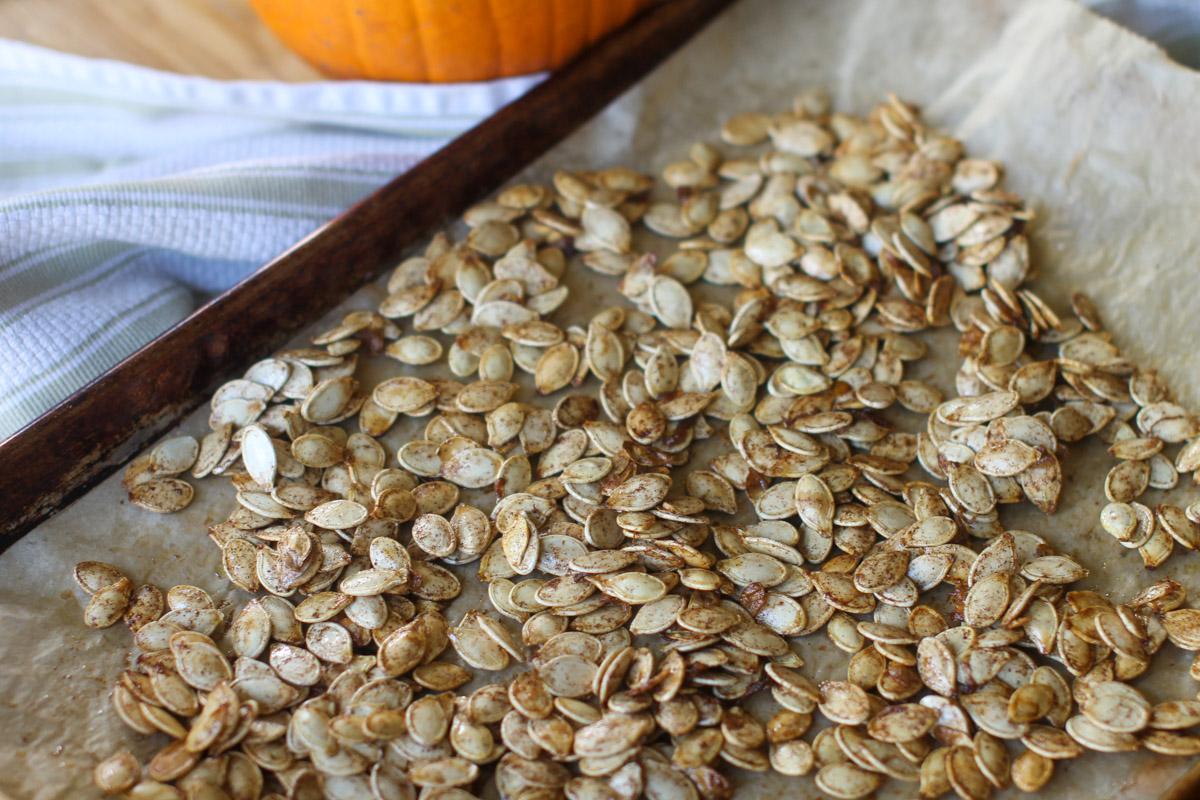 A sheet pan of Sweet and Salty Roasted Pumpkin Seeds.