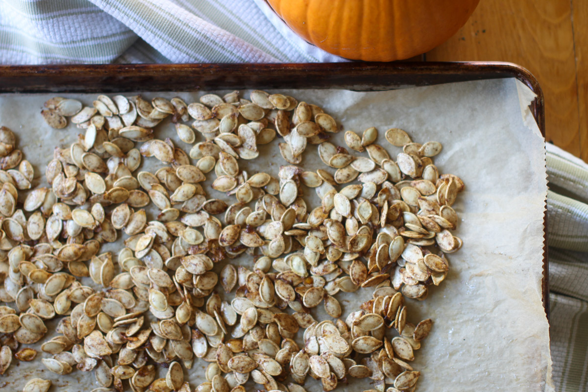 Sweet and Salty Roasted Pumpkin Seeds on a baking sheet.