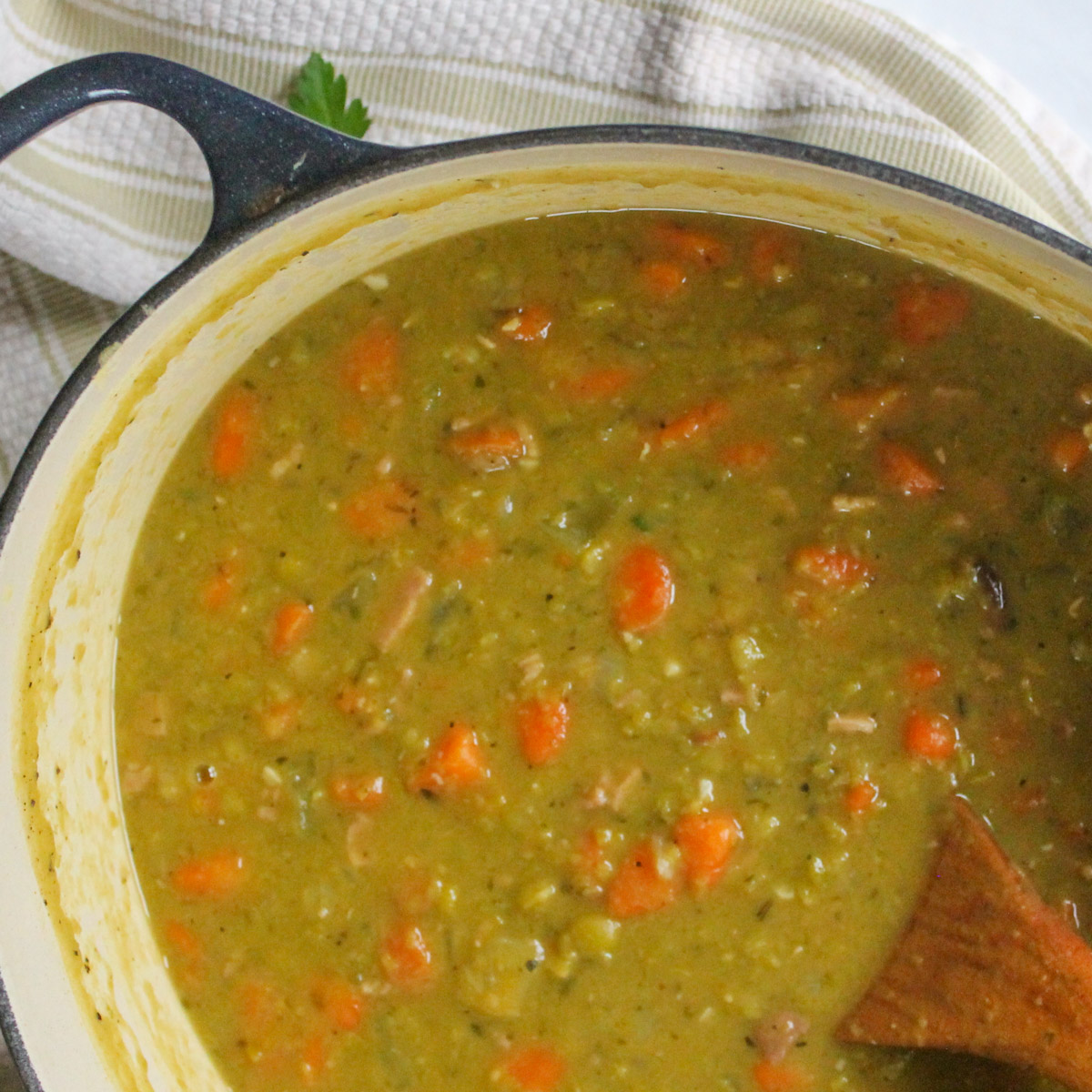 A top down look at the finished pot of split pea soup with ham.