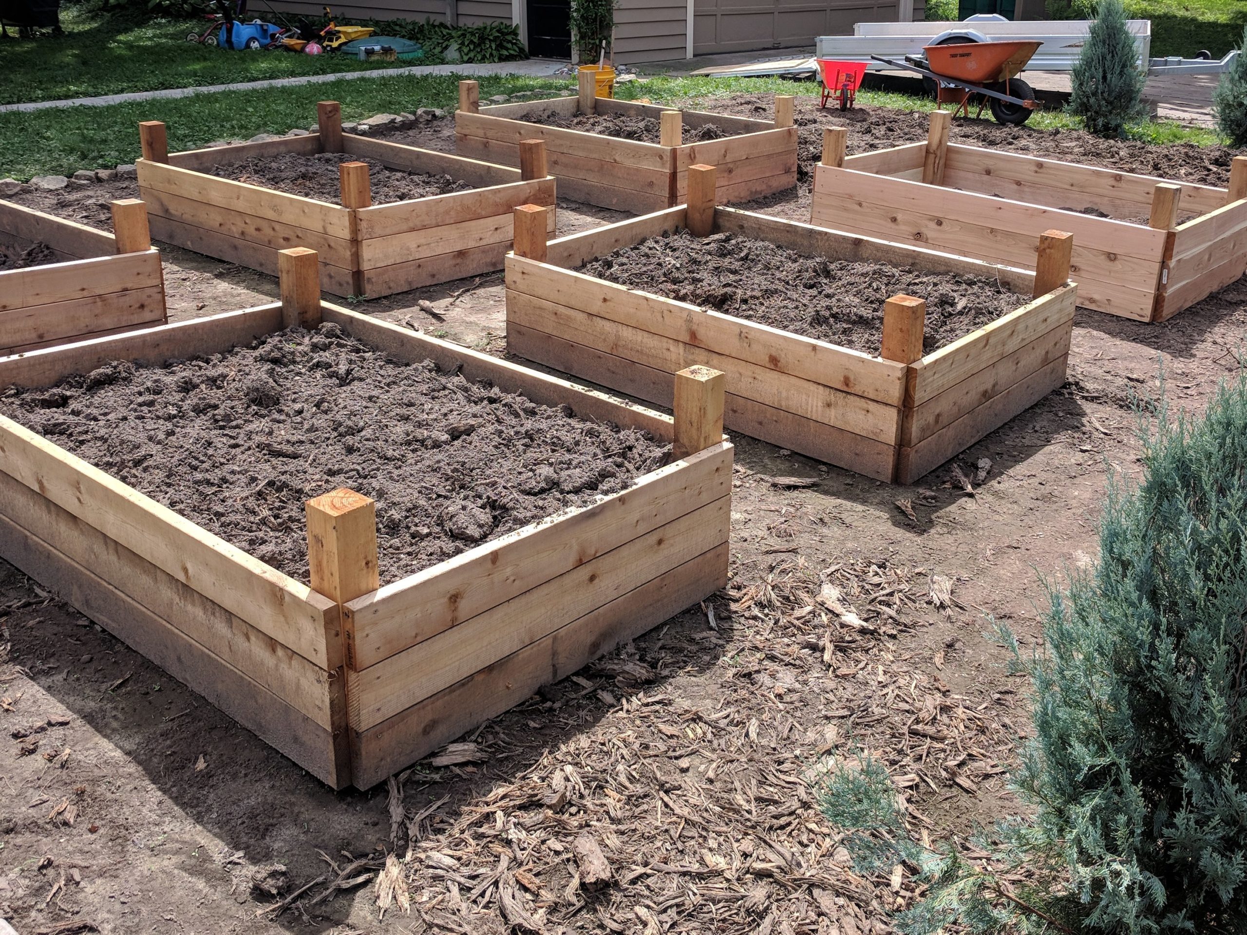 Process of building raised bed gardens.