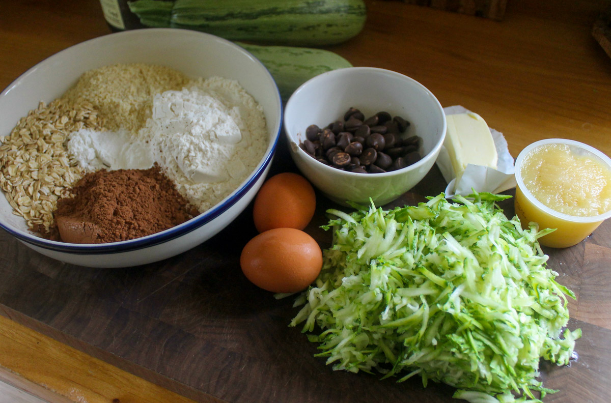 Double Chocolate Zucchini Muffin ingredients on a cutting board.