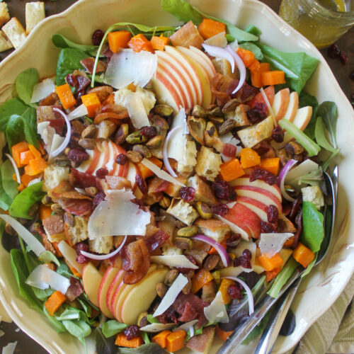 Maple butternut squash fall salad with apples, bacon, pistachios, and Parmesan.