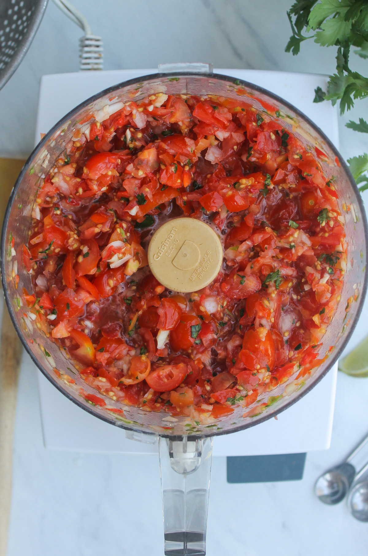 Cherry tomato pico de gallo in a food processor.