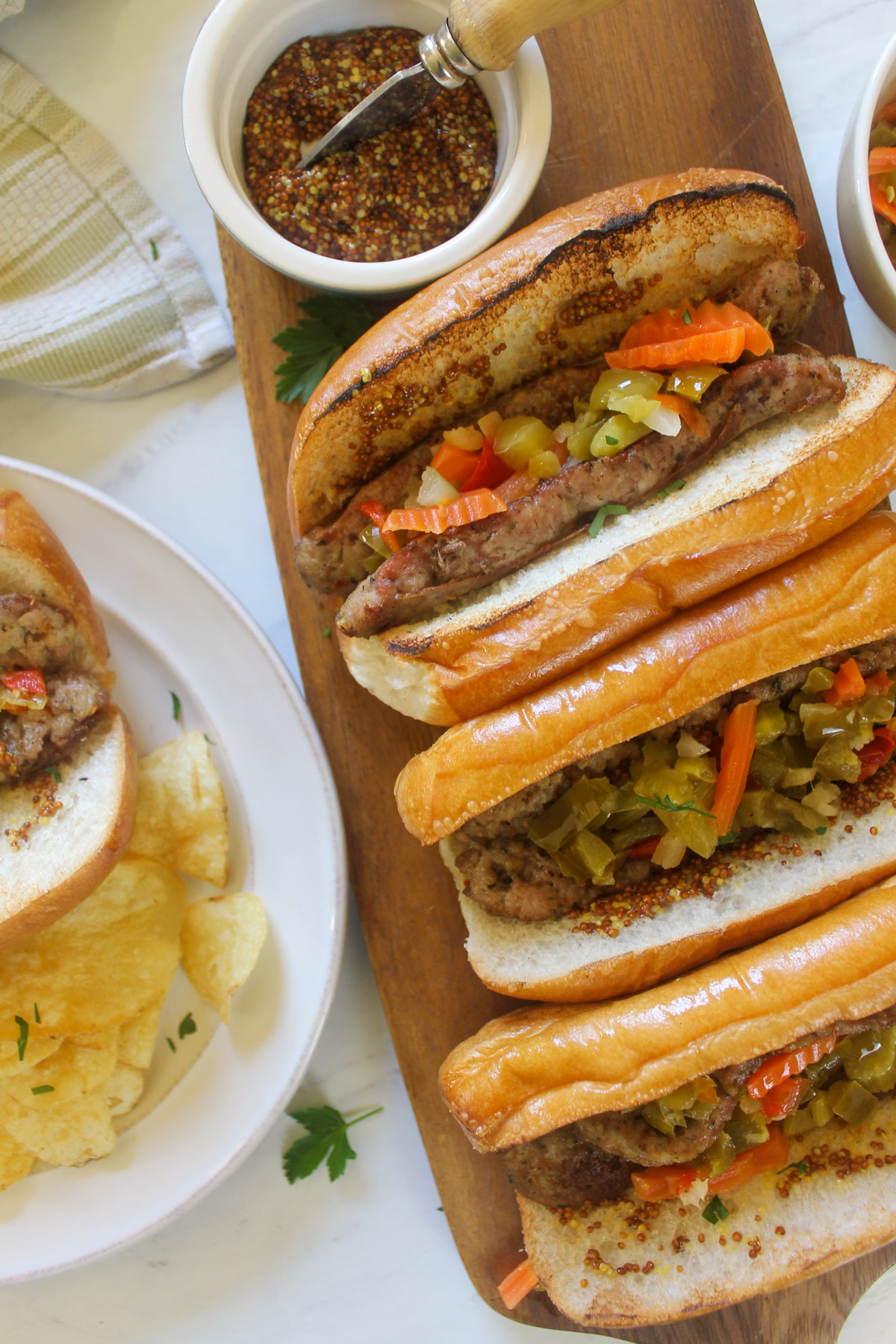 Grilled Split Italian Sausages on hoagie buns with Giardiniera.