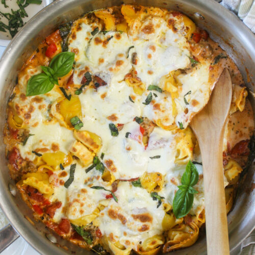 One Pot Baked Tortellini with Italian Sausage with melty mozzarella cheese and fresh basil.