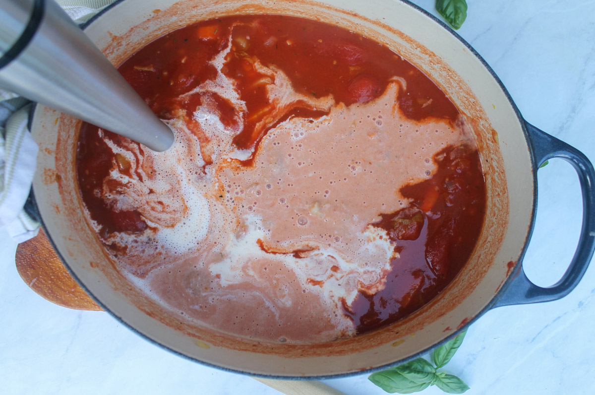 Blending Tomato Soup with the cream just added with an immersion blender.