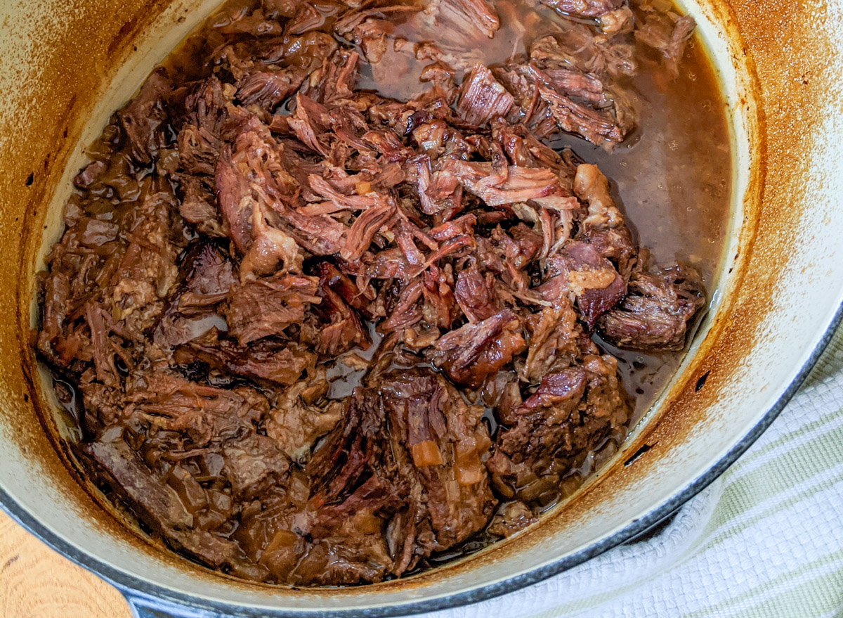 The finished pot of shredded beef roast.