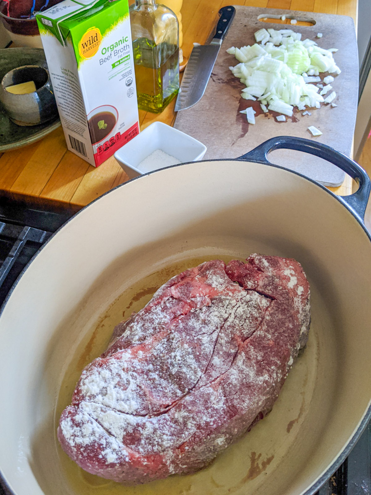 Beginning to sear the beef roast coated in flour.