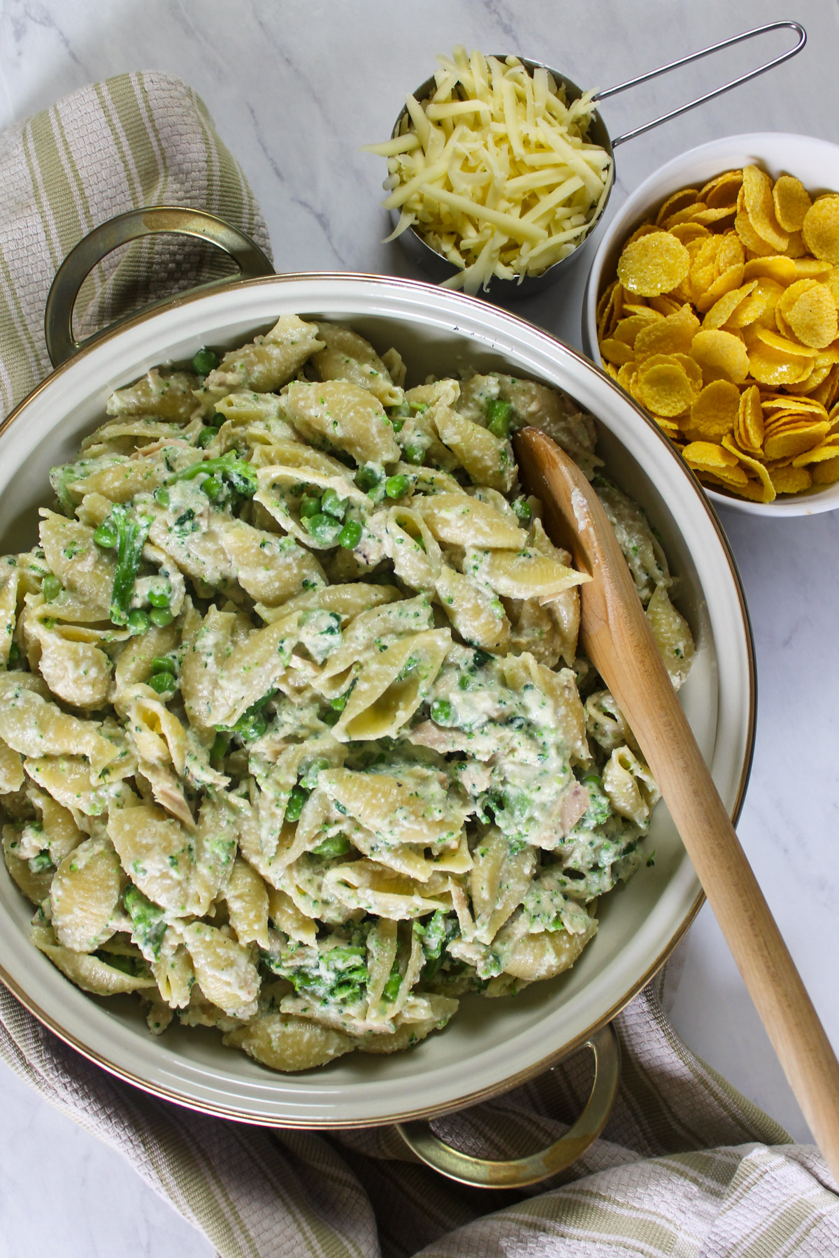 Mixing the tuna broccoli casserole together before adding the topping.