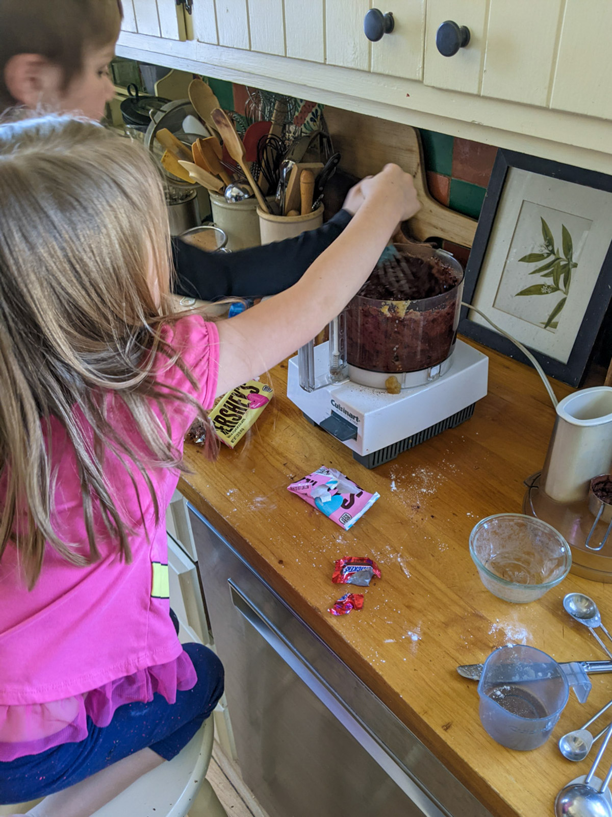 Kids at the counter helping to make brownies.