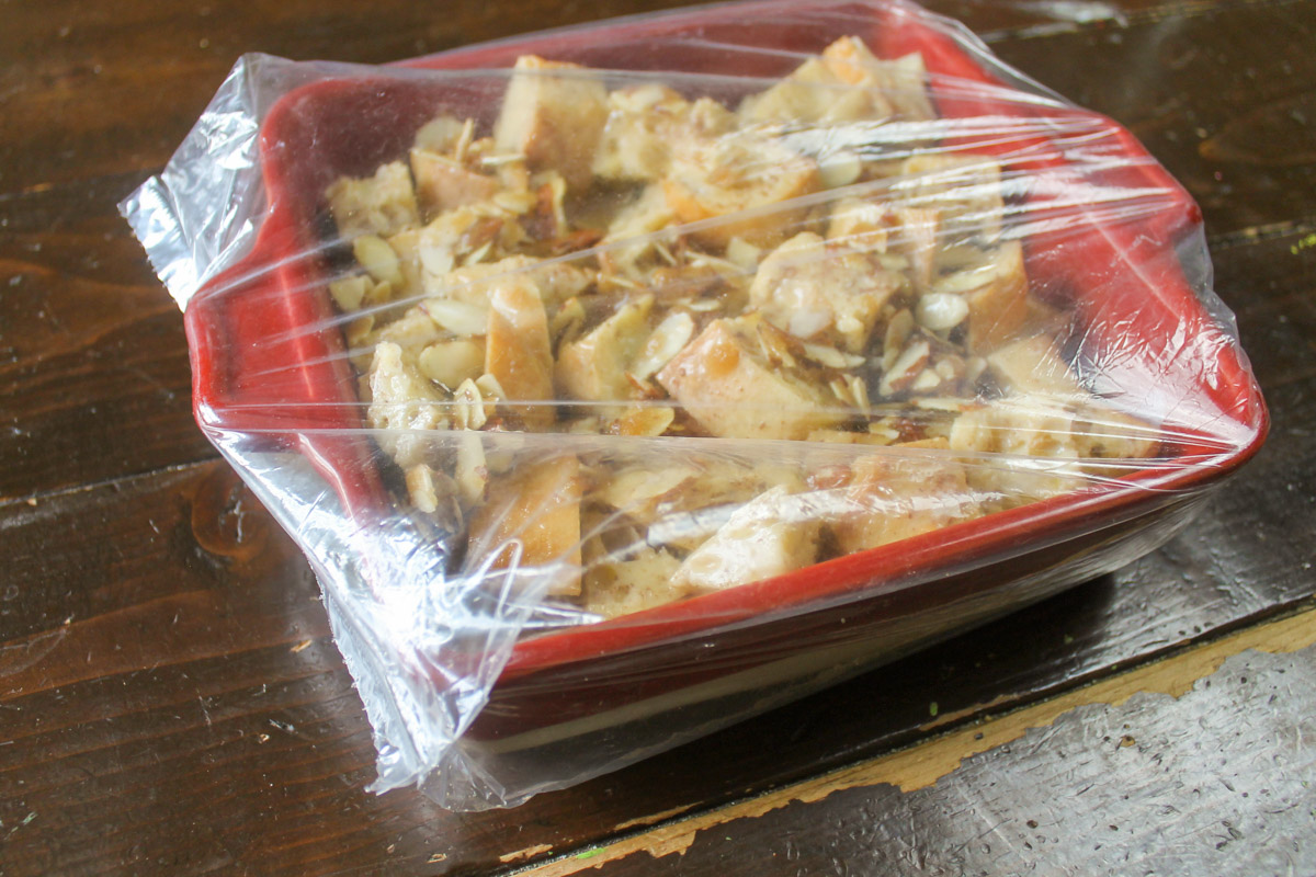 The French Toast Bake Casserole covering in a plastic bread bag to be refrigerated overnight before baking.