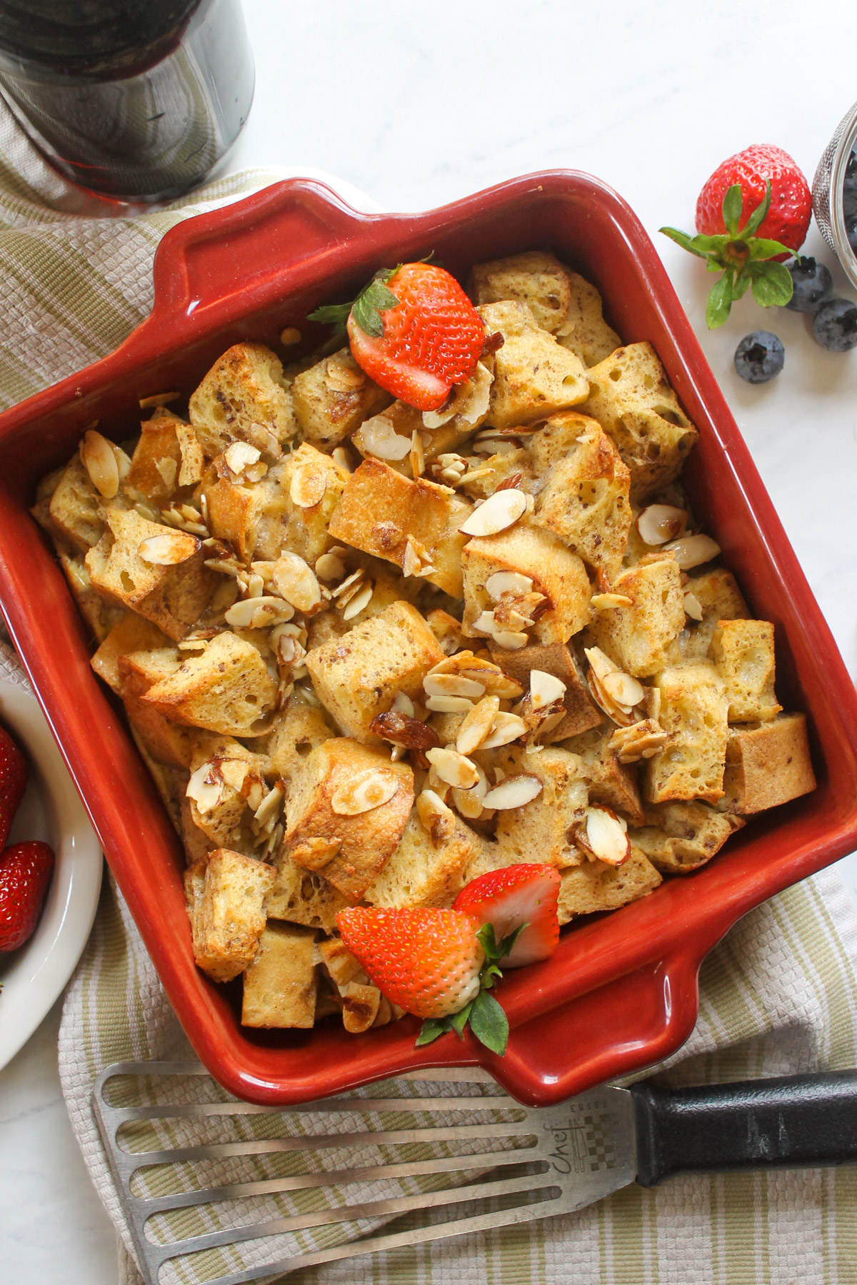 Protein French Toast Bake with berries and almond topping.